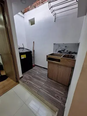 an empty kitchen with a sink and a counter at Apartamento Laureles con Jacuzzi cerca al primer parque in Medellín