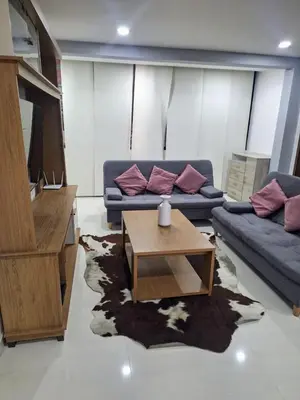 a living room with a couch and a coffee table at Apartamento Cerca a Primer Parque de Laureles in Medellín