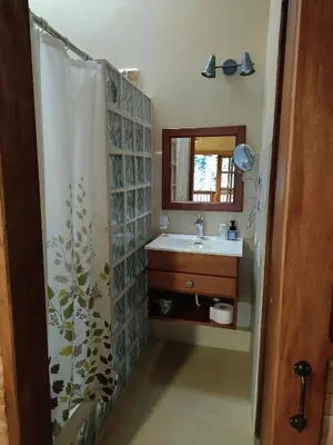 a bathroom with a sink and a shower curtain at Finca MonteSer in Jardin