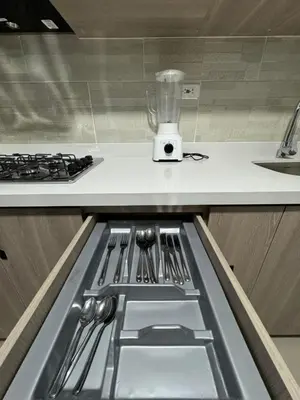 a kitchen with a counter with a stove and a kitchen sidx sidx sidx at Apartamento céntrico en Medellín in Medellín