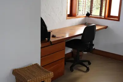 an office with a desk with a chair and a computer at Casa finca pietrasanta in Rionegro