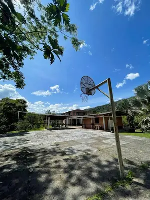 an empty basketball hoop in front of a building at Finca Kikua in San Rafael
