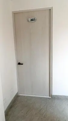 a door with a sign on it in a room at Hermoso Apartamento en Belén in Medellín