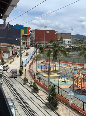 a park with a playground with a roller coaster at Apartamento en Guatapé por noches in Guatapé