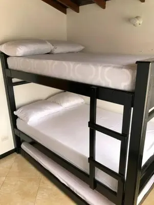 a couple of bunk beds in a room at Apartamento en Guatapé por noches in Guatapé