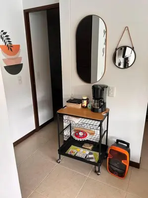 a room with a table and a mirror on the wall at Casa Lupita Hermoso apartasol in Santa Fe de Antioquia