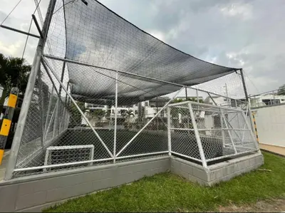 a batting cage with a net on a field at Casa Lupita Hermoso apartasol in Santa Fe de Antioquia