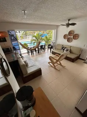 a living room with a couch and a table at Casa Lupita Hermoso apartasol in Santa Fe de Antioquia