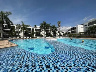 a large swimming pool with blue tiles on it at Casa Lupita Hermoso apartasol in Santa Fe de Antioquia