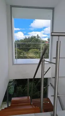 a room with a window and stairs with a view at Casa Campestre Bellavista in Villamaría