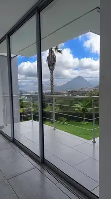 a view of a palm tree from a balcony at Casa Campestre Bellavista in Villamaría