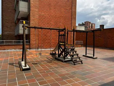 a gym on the roof of a brick building at Bright and Modern Medellin Apartment in Medellín
