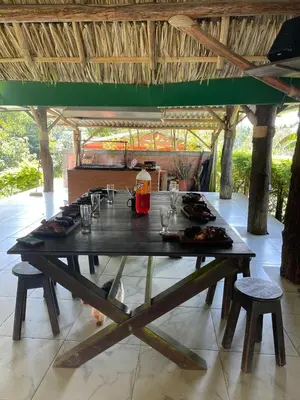 a large wooden table with plates of food on it at Rancho forest Victoria in Victoria