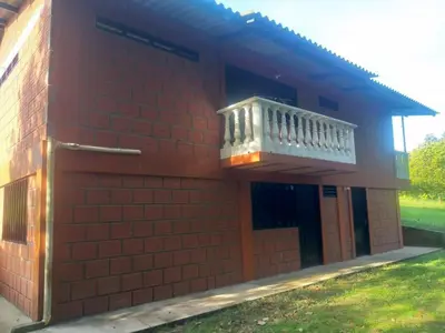 a red brick building with a balcony on it at Rancho forest Victoria in Victoria