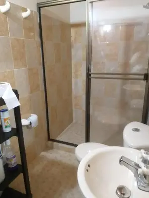 a bathroom with a shower and a sink and a toilet at Rancho forest Victoria in Victoria
