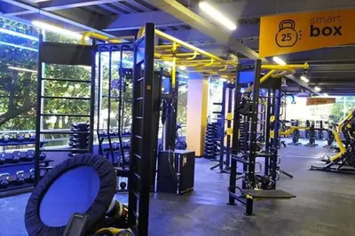 a gym with treadmills and machines in it at Party house, rooftop terrace with Jacuzzi poblado, Movie Theater in Envigado