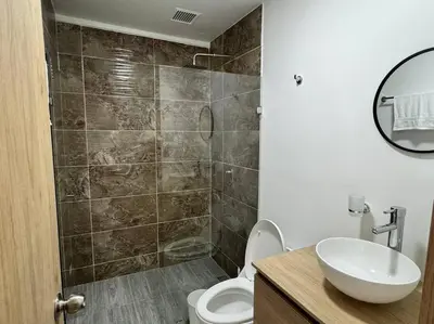 a bathroom with a sink and a toilet and a shower at Dream apt close to Unicentro - spacious - with AC in Medellín