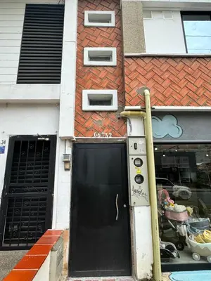 a black door in front of a building at Dream apt close to Unicentro - spacious - with AC in Medellín