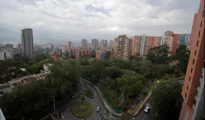 a view of a city with tall buildings and a road at Espacio Ideal para Disfrutar Medellin in Medellín