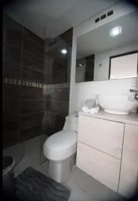 a bathroom with a toilet and a sink at Espacio Ideal En Pausa in Medellín