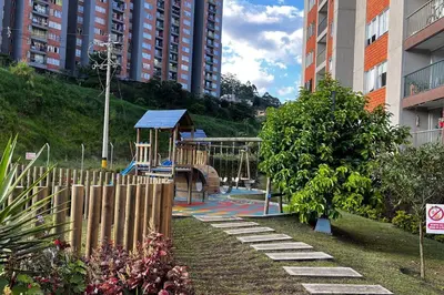 a park with a playground in a city with buildings at Mirador la casa del cóndor 3 habitaciones in Itagüí