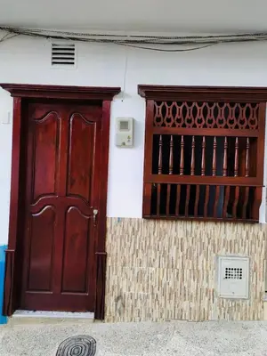 a pair of doors on the side of a building at Hospedaje Casa Silvana in Jardin