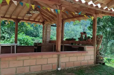 an outdoor pavilion with a brick wall and awning at Polandia in Villa Silvia