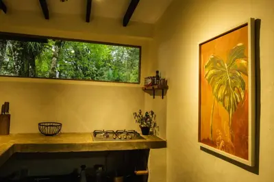 a kitchen with a sink and a window at Peaceful rustic cabin steps from town in Jericó
