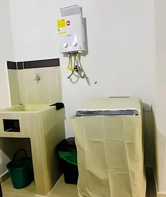 a room with a machine and a trash can at 9804 · 9804 Loft Env. good view local experience confort in Envigado