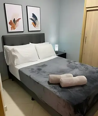 a bedroom with a bed with two pillows on it at 9902Aparta estudio totalmente dotado WiFi200 megas in Envigado
