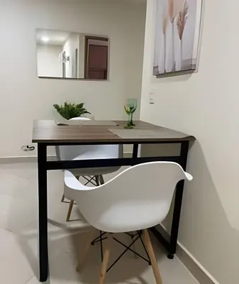 a desk with a white chair in a room at 9904 Acogedor y cómodo aparta estudio dotado in Envigado