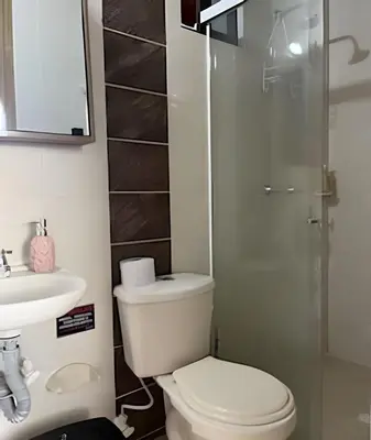 a bathroom with a toilet and a sink and a shower at beautiful view of the city with local experience in Envigado