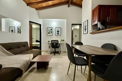 a living room with a couch and a table at Duplex con terraza en el corazón de Envigado 300mb in Envigado