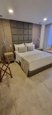 a bedroom with a large bed in a room at Hotel 45 Park in Sabaneta