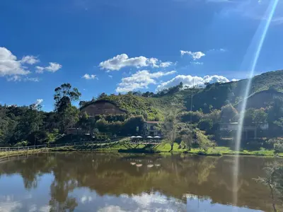 a view of a river with mountains in the background at Los Lagos de Jasú in San Vicente