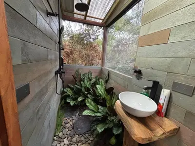 a bathroom with a sink and a window at PrivaDune in Rionegro