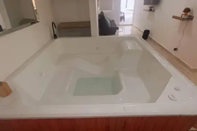 a large white bath tub in a room at Casa de Ensueño El Poblado in Medellín
