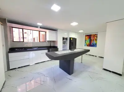 a kitchen with a large island in the middle at Apartamento Ejecutivo El Poblado Renta Larga 28 dias Amueblado WiFi in Medellín