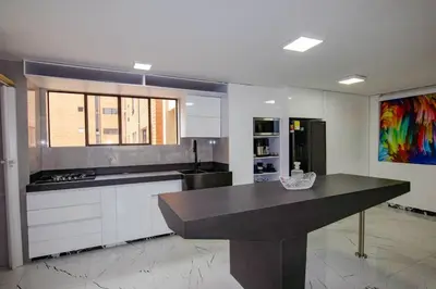 a kitchen with a large island in a room at Apartamento Ejecutivo El Poblado Renta Larga 28 dias Amueblado WiFi in Medellín