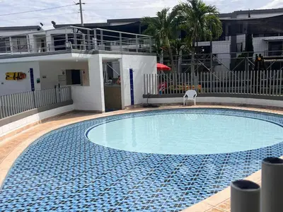 a large swimming pool in front of a house at Ciudadela Santa Fe in Santa Fe de Antioquia