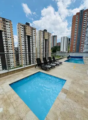 a swimming pool on the roof of a building at Moderno Apartamento en Sabaneta cerca al parque in Sabaneta