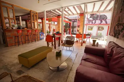 a living room with a couch and a table at La Oculta Hostal in Jericó