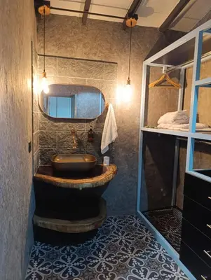 a bathroom with a sink and a mirror at Hotel Nuss in San Roque