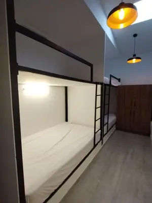 a bedroom with a bunk bed in a room at Hostal The Nest By Ulivin in Manizales
