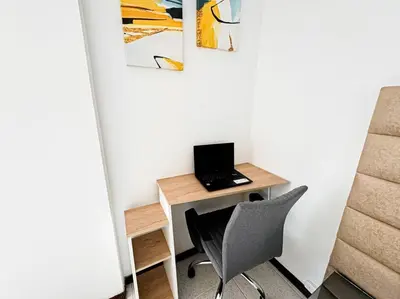 a desk with a laptop computer on top of it at Exclusivo apartamento en Poblado con AC a 1 min Provenza in Medellín