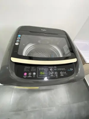 a washing machine sitting on top of a counter at Hermoso y cómodo apartamento in Sabaneta