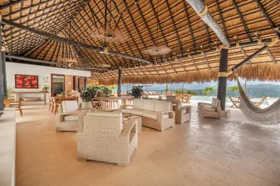 a living room with a hammock in a resort at Fina Estampa Country Hotel - Mayores de 10 años in Támesis