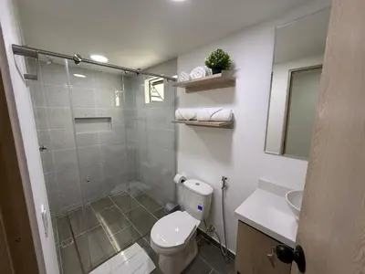 a bathroom with a shower and a toilet and a sink at Vive Medellin 401 in Medellín