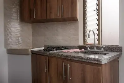 a kitchen with a sink and a counter top at Apartamento en el Cable mejor zona en Manizales in Manizales