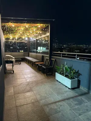 a balcony with a view of a city at night at Vive Medellin 302 in Medellín